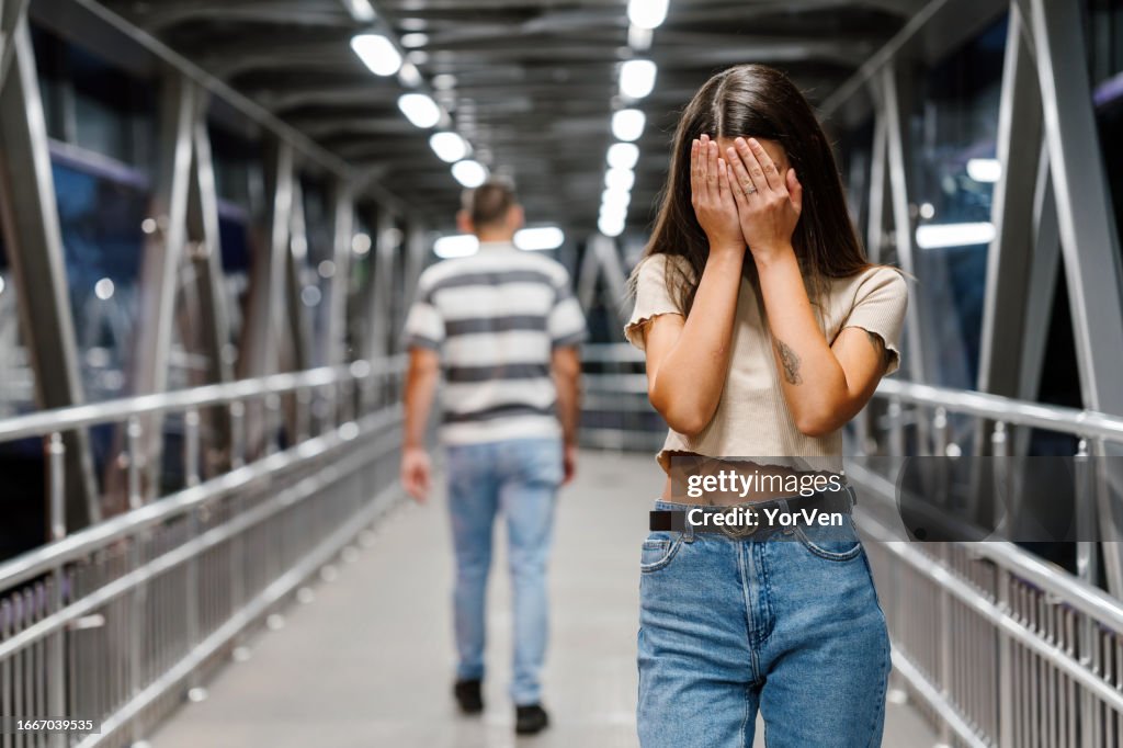 Sad upset woman crying after a painful break-up