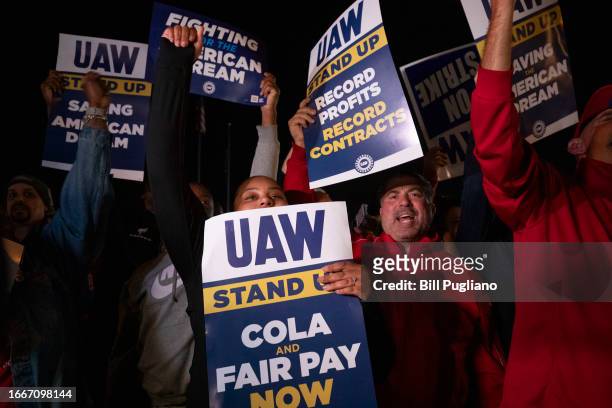 Supporters and workers cheer as United Auto Workers members go on strike at the Ford Michigan Assembly Plant on September 15, 2023 in Wayne,...