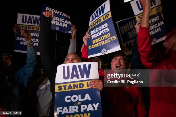 Supporters and workers cheer as United Auto Workers members go on strike at the Ford Michigan Assembly Plant on September 15, 2023 in Wayne,...