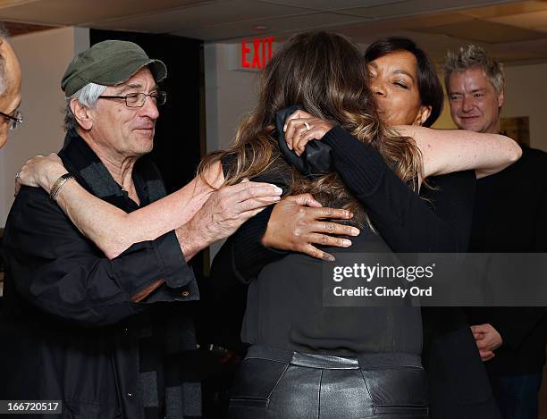 Actress Rita Wilson visits with Robert De Niro, Grace Hightower and Chris Botti backstage following her performance at 54 Below on April 15, 2013 in...