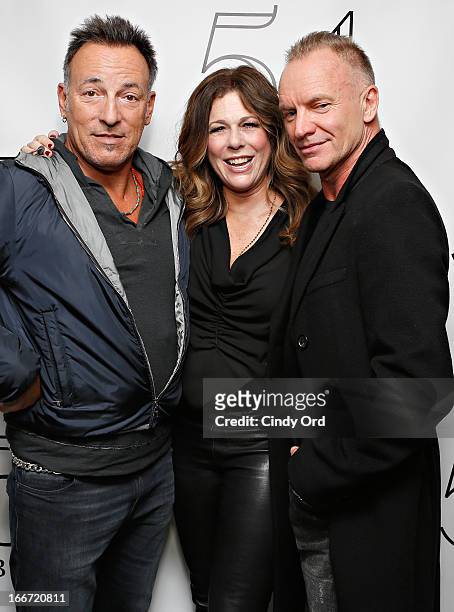 Actress Rita Wilson poses with Bruce Springsteen and Sting backstage following her performance at 54 Below on April 15, 2013 in New York City.