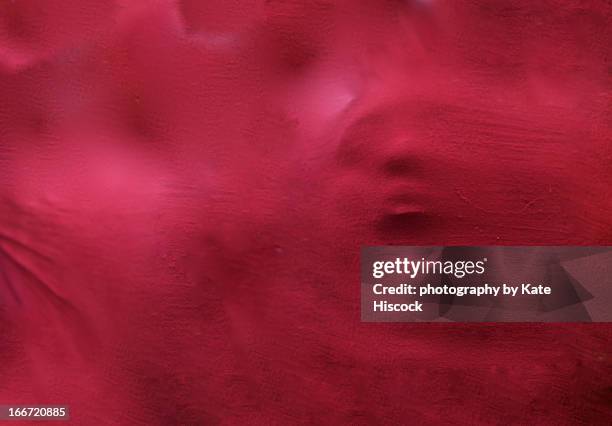 a scary / hunting face coming through red fabric - halloween scary faces fotografías e imágenes de stock