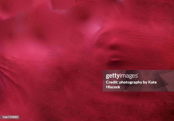 a scary / hunting face coming through red fabric - spooky 個照片及圖片檔