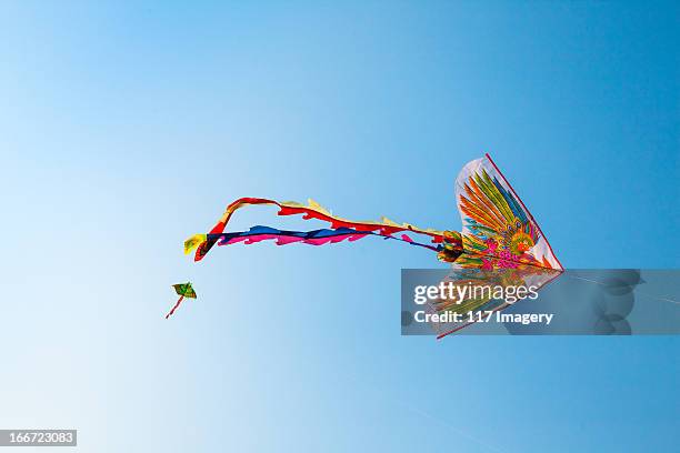 flying kite in the blue sky - vietnam, asia - kite flying stock pictures, royalty-free photos & images