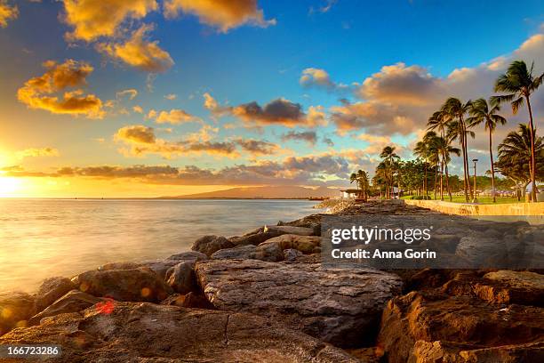 sunset at kaka'ako, o'ahu - honolulu beach stock pictures, royalty-free photos & images