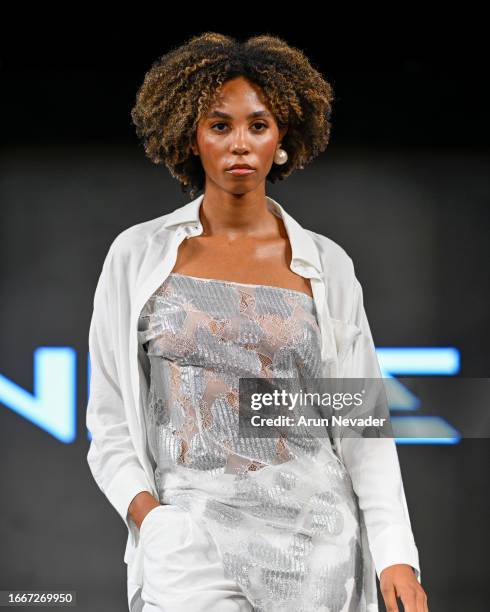 Model walks the runway wearing Nizie during New York Fashion Week Powered by Art Hearts Fashion at The Angel Orensanz Foundation on September 07,...