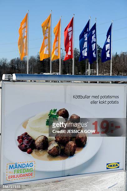 This picture taken on February 25, 2013 shows an advertising billboard for IKEA meat balls at a parking of an IKEA store in Stockholm. Furniture...