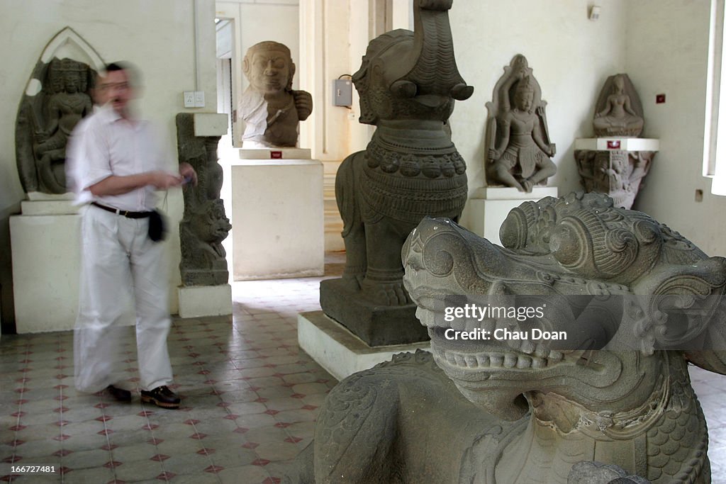A tourist walks inside the Cham museum in Danang. The dragon...