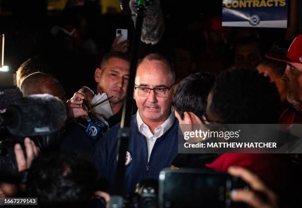 President Shawn Fain speaks with members of the media and members of the UAW outside of the UAW Local 900 headquarters across the street from the...