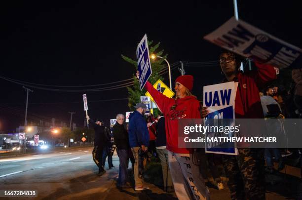 Members of the UAW picket and hold signs outside of the UAW Local 900 headquarters across the street from the Ford Assembly Plant in Wayne, Michigan...