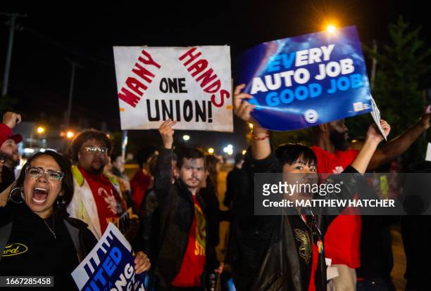 Members of the UAW picket and hold signs outside of the UAW Local 900 headquarters across the street from the Ford Assembly Plant in Wayne, Michigan...