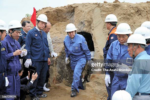 Japanese Prime Minister Shinzo Abe pays visit to a site considered to be a trench of the Japanese army from the World War II time at Iwo Island on...