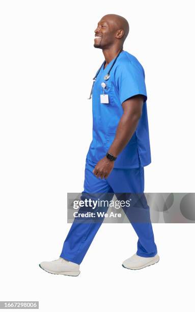 medical practitioner walking - surgeon walking stock pictures, royalty-free photos & images