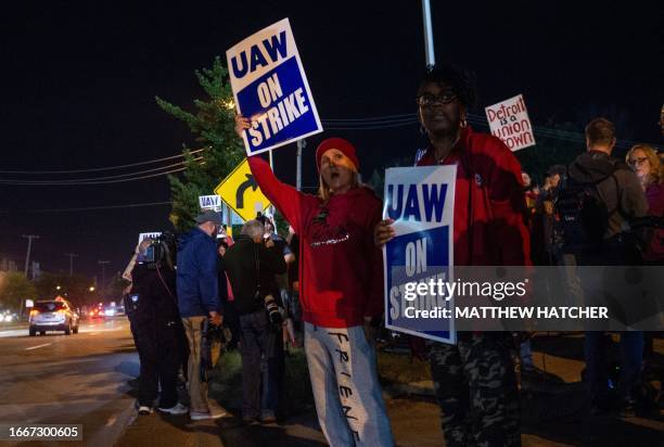 Members of the UAW picket and hold signs outside of the UAW Local 900 headquarters across the street from the Ford Assembly Plant in Wayne, Michigan...