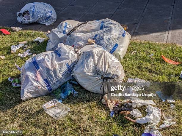 waste recycling bags ready for collection - garbage bag stock pictures, royalty-free photos & images