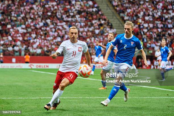 Kamil Grosicki from Poland fights for the ball with Joannes Danielsen from Faroe Islands during the UEFA 2024 European Qualifiers group E match...