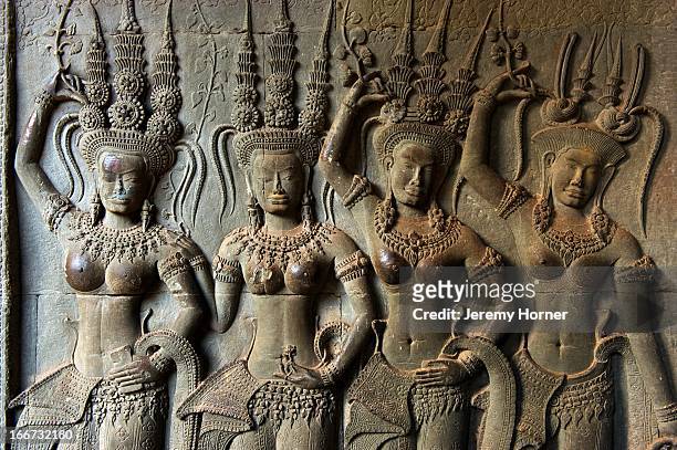 Apsaras carved into the corridor walls at Angkor Wat's main temple complex. Angkor Wat is the largest Hindu temple complex and the largest religious...