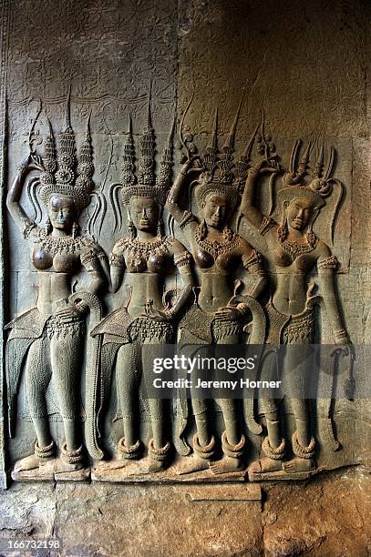 Apsaras carved into the corridor walls at Angkor Wat's main temple complex. Angkor Wat is the largest Hindu temple complex and the largest religious...