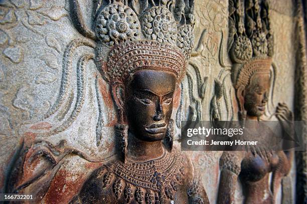 Apsaras carved into the corridor walls at Angkor Wat's main temple complex. Angkor Wat is the largest Hindu temple complex and the largest religious...