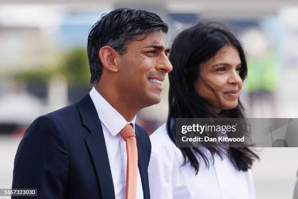 Prime Minister Rishi Sunak his wife Akshata Murty are met on the tarmac by dignitaries as they arrive at Indira Gandhi Airport for an offical visit...