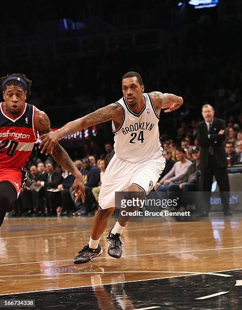 Kris Joseph of the Brooklyn Nets dribbles the ball against the Washington Wizards at the Barclays Center on April 15, 2013 in New York City. The Nets...