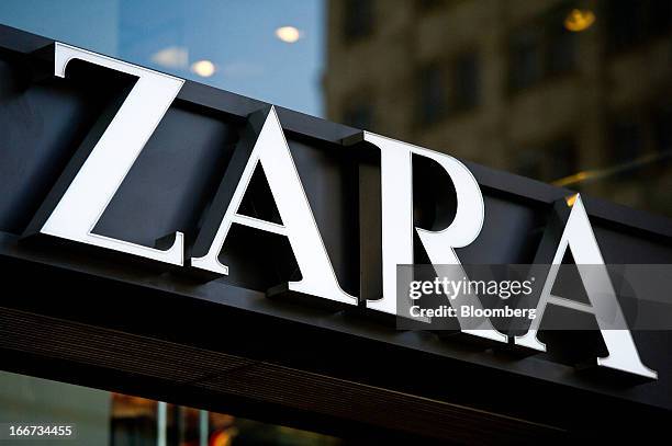 Logo sits on display above the entrance to a Zara retail store, operated by Inditex SA, in Barcelona, Spain, on Tuesday, April 16, 2013. Mango has...