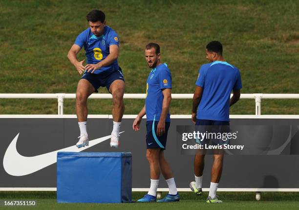 Harry Maguire and Harry Kane of England train during an England Men Training Session at St Georges Park on September 08, 2023 in Burton-upon-Trent,...