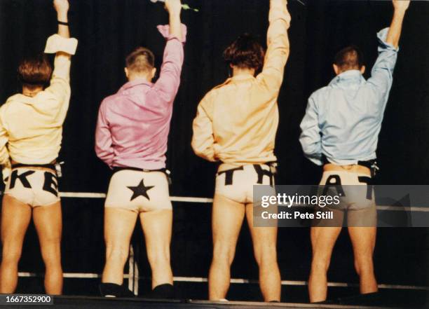 Mark Owen, Gary Barlow, Robbie Williams and Jason Orange of English pop group Take That perform on stage at Wembley Arena on July 26th, 1993 in...