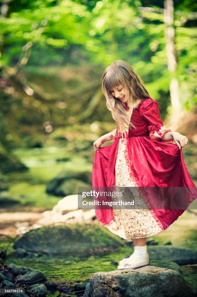 Little princess crossing the stream