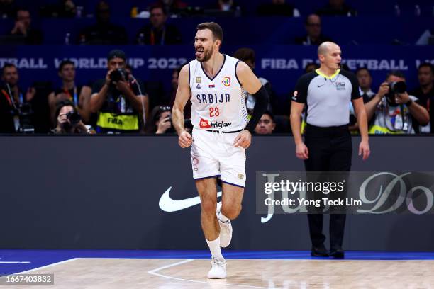 Marko Guduric of Serbia celebrates after scoring a three-pointer in the fourth quarter during the FIBA Basketball World Cup semifinal game against...
