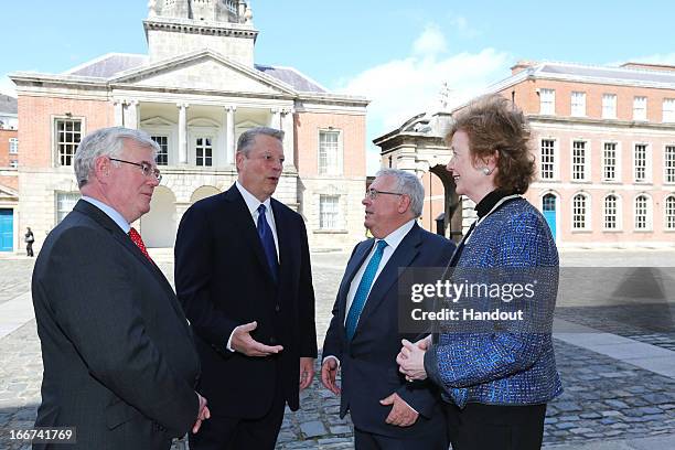 In this handout image provided by the Dept of the Taoiseach, Former Vice President of the United States, Al Gore is welcomed to Dublin Castle by...