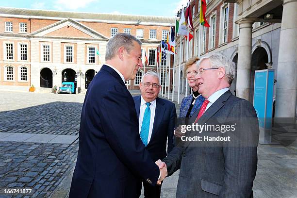 In this handout image provided by the Dept of the Taoiseach, Former Vice President of the United States, Al Gore is welcomed to Dublin Castle by...