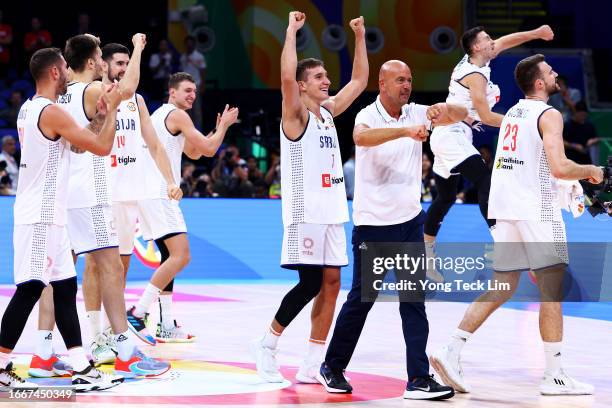 Bogdan Bogdanovic of Serbia celebrates with teammates after the FIBA Basketball World Cup semifinal game victory over Canada at Mall of Asia Arena on...