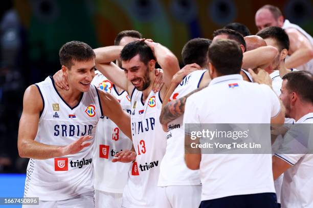 Bogdan Bogdanovic and Ognjen Dobric of Serbia celebrate after the FIBA Basketball World Cup semifinal game victory over Canada at Mall of Asia Arena...