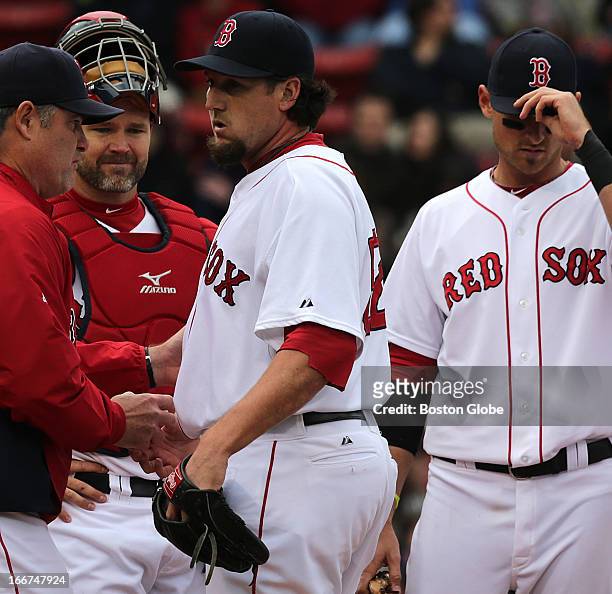 Boston Red Sox relief pitcher Joel Hanrahan is lifted in the ninth inning by Boston Red Sox manager John Farrell as the Boston Red Sox hosted the...