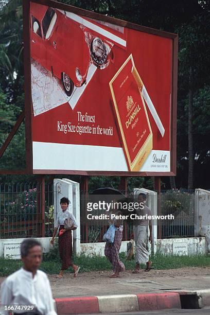 Large billboard advertises Dunhill cigarettes..