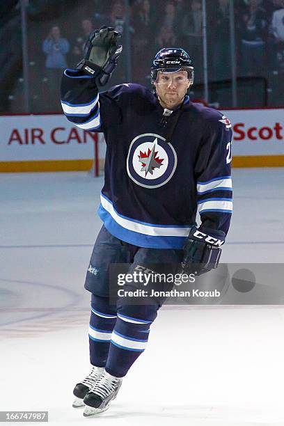 Aaron Gagnon of the Winnipeg Jets waves to the home fans after being named the third star of the game following a 4-1 victory over the Buffalo Sabres...