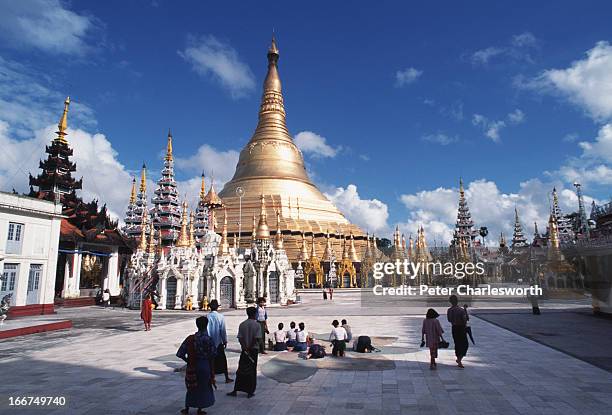 In the late afternoon people make merit and pray at the Shwedagon Pagoda..
