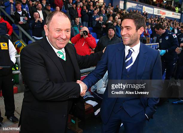 Lee Johnson the manager of Oldham Athletic shakes hands with his father Gary Johnson the manager of Yeovil Town prior to the npower League One match...