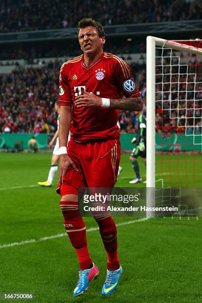 Mario Mandzukic of Muenchen reacts after scoring the opening goal during the DFB Cup Semi Final match between Bayern Muenchen and VfL Wolfsburg at...