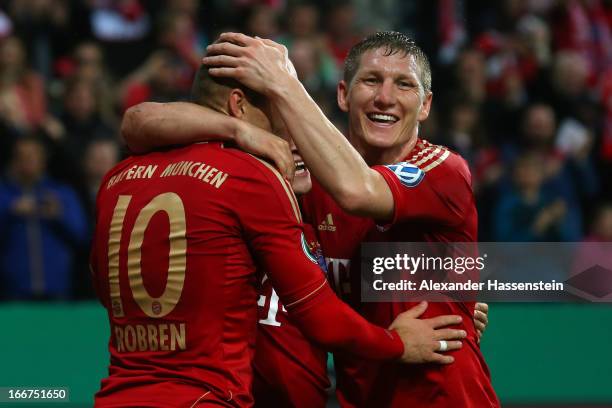 Arjen Robben of Muenchen celebrates scoring the 2nd team goal with his team mates Xherdan Shaqiri and Bastian Schweinsteiger during the DFB Cup Semi...