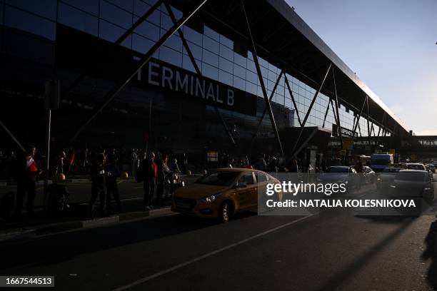 Passengers wait for their taxis at Moscow's Sheremetyevo International Airport on September 14, 2023.
