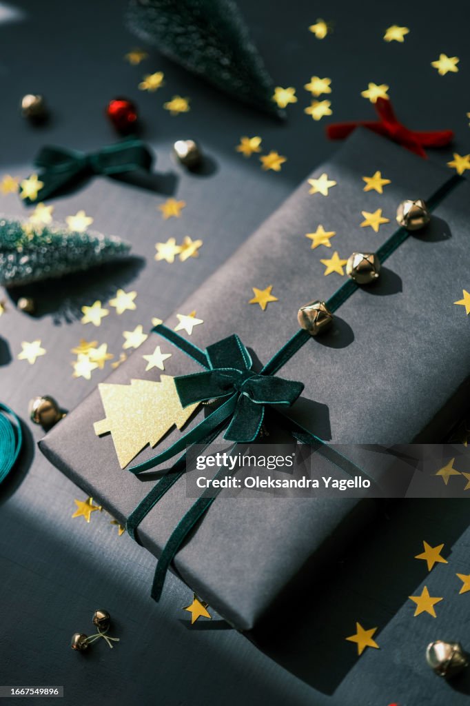Black Kraft Wrapping Paper And Bells Velvet Ribbons High-Res Stock Photo -  Getty Images