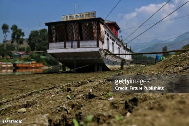 September 12 Srinagar Kashmir, India : View of dried up patches on the banks of River Jhelum in Srinagar. The water level in the River Jhelum has...