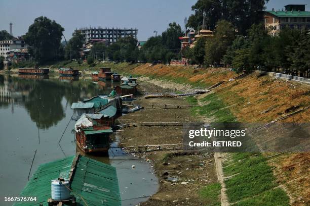 September 12 Srinagar Kashmir, India : View of dried up patches on the banks of River Jhelum in Srinagar. The water level in the River Jhelum has...