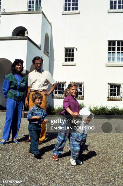 King Carl Gustaf of Sweden and his wife Queen Silvia pose, 29 june 1983 with their children Prince Carl Philip, Crown princess Victoria and Princess...