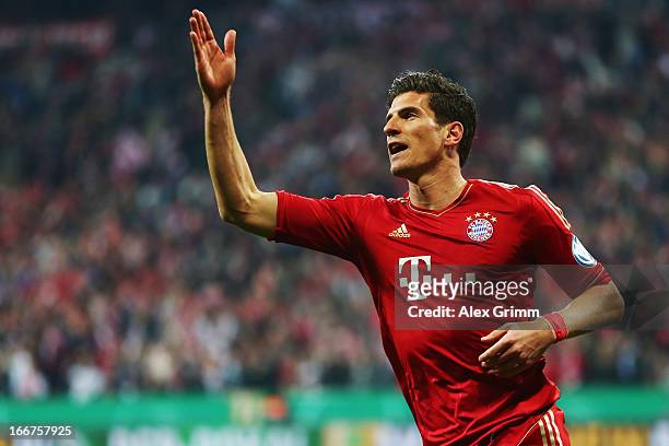 Mario Gomez of Muenchen celebrates his team's fifth goal during the DFB Cup Semi Final match between Bayern Muenchen and VfL Wolfsburg at Allianz...