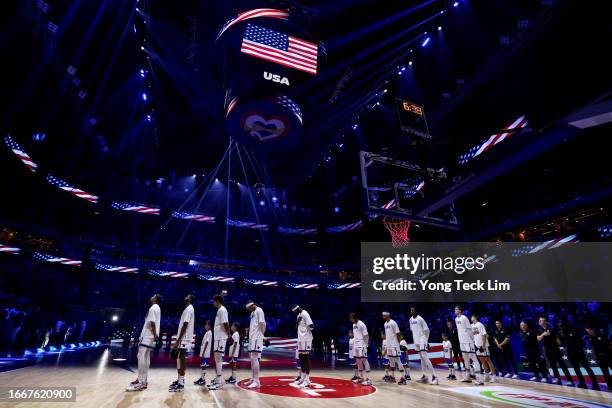 The United States players, coaches and officials stand for the national anthem prior to the FIBA Basketball World Cup semifinal game against Germany...