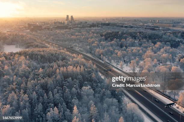 highway to stockholm in winter - stockholm park stock pictures, royalty-free photos & images