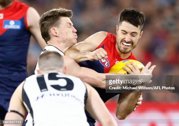 Sam Walsh of the Blues and Alex Neal-Bullen of the Demons in action during the 2023 AFL First Semi Final match between the Melbourne Demons and the...